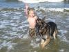 baby and dog in water in ga